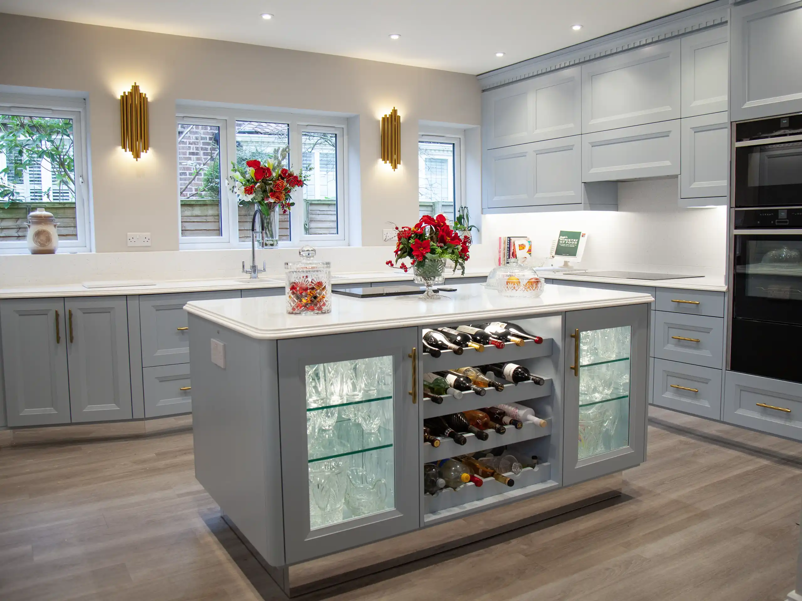 Bespoke kitchen overview with custom-made island, cabinetry, and wine storage in Hale, Cheshire.