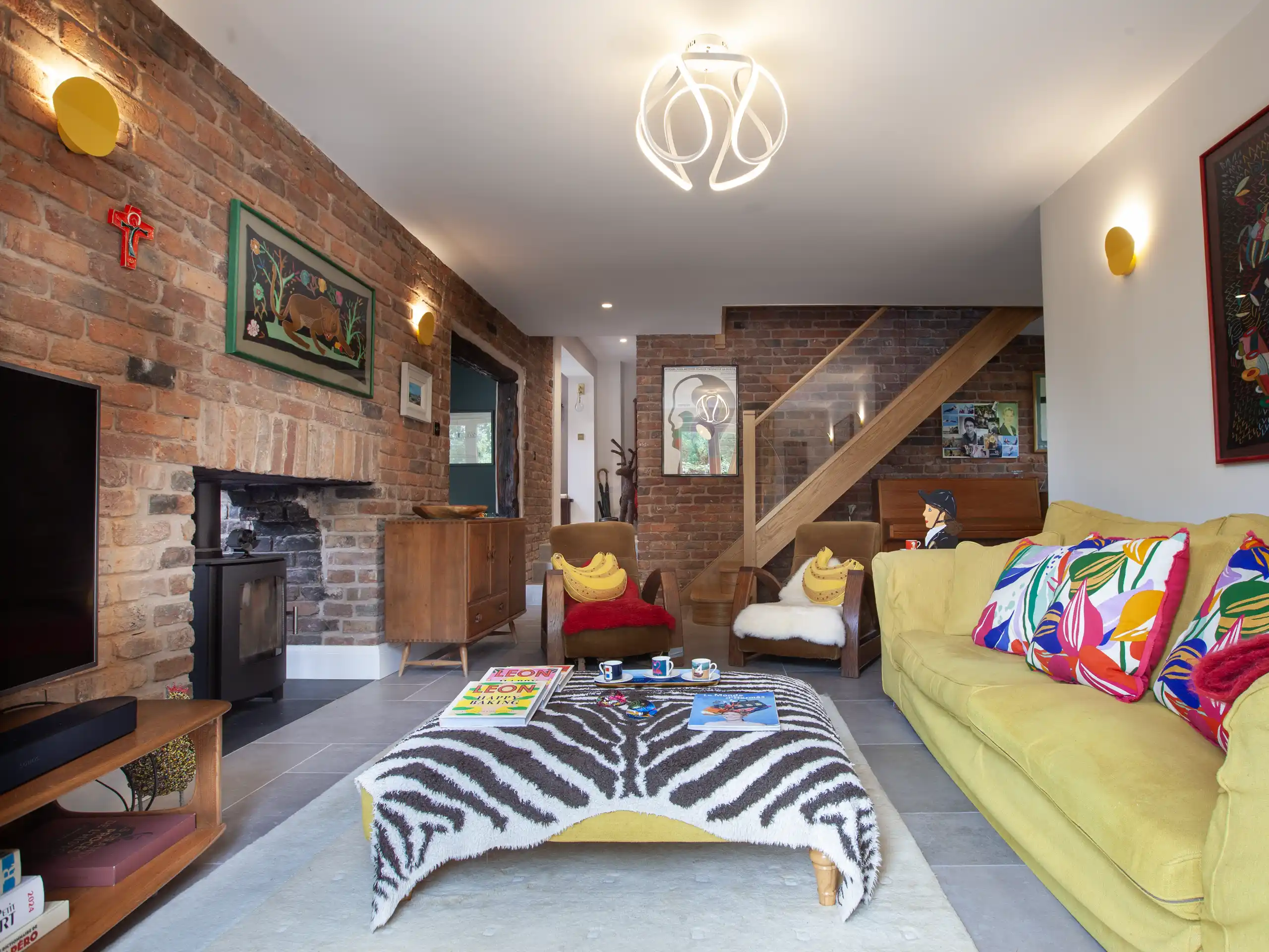 Brick fireplace living room with wood burner and retro decor.Brick fireplace living room with wood burner and retro decor.