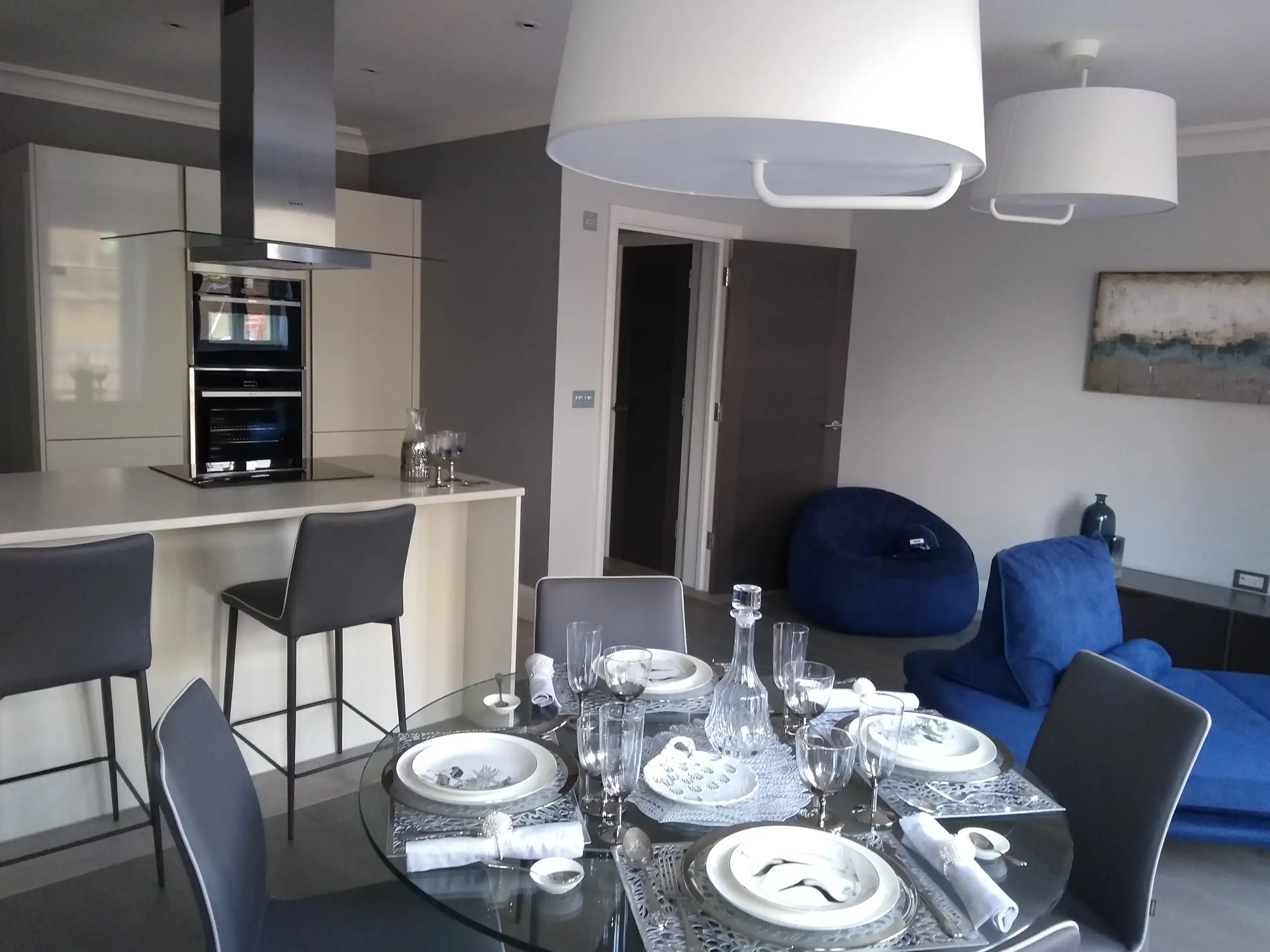 Luxurious dining area with glass table and minimalist décor