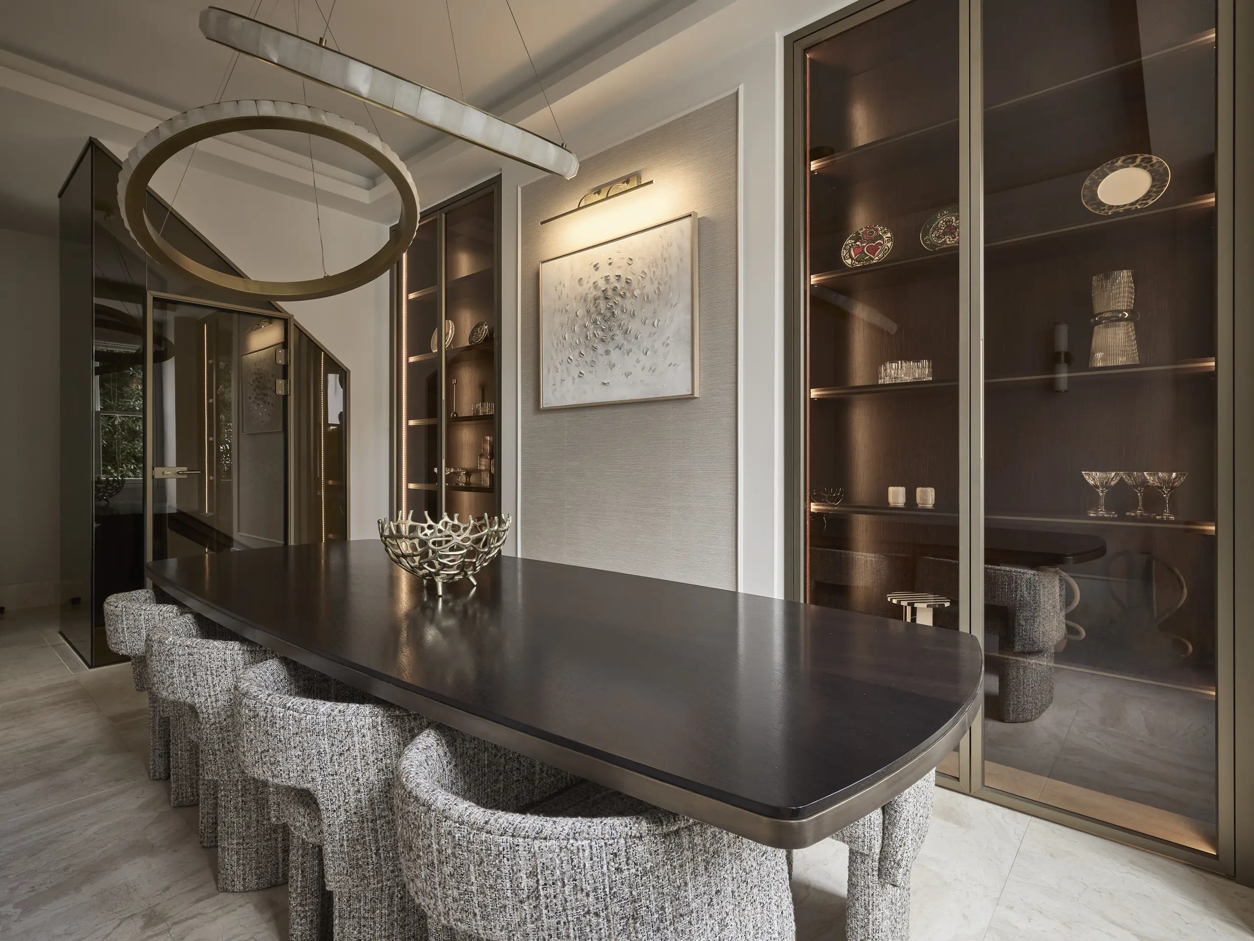 Wilmslow, Cheshire dining room with bespoke bronze-framed cabinetry, ring pendant and a dark timber table, designed by The Space Whisperer